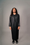 Man wearing a black Moroccan kaftan for men, full length front view