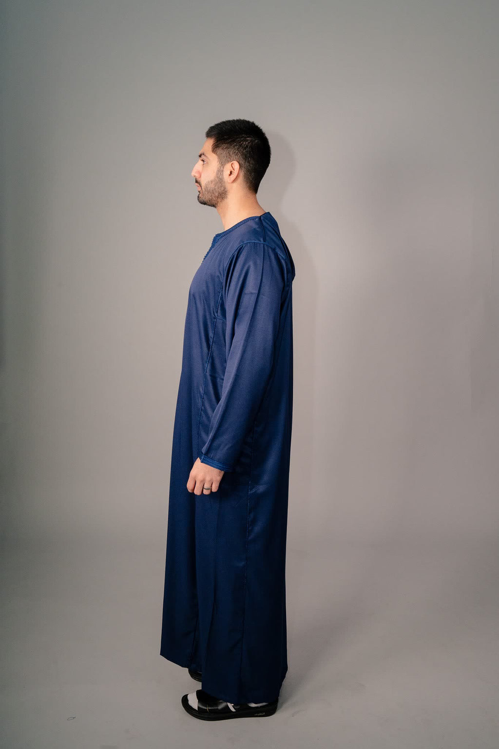 Deep blue Moroccan kaftan shown full length on a model