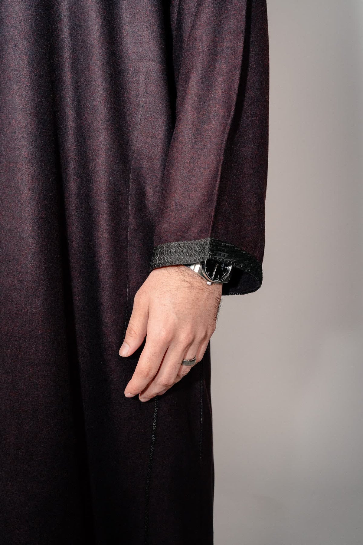 Side profile of a deep burgundy Moroccan winter djellaba