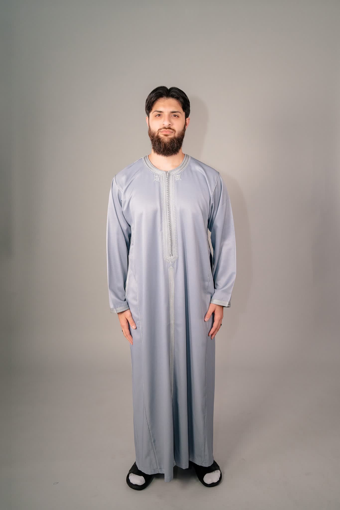 Man wearing a gray Moroccan kaftan for men, front view