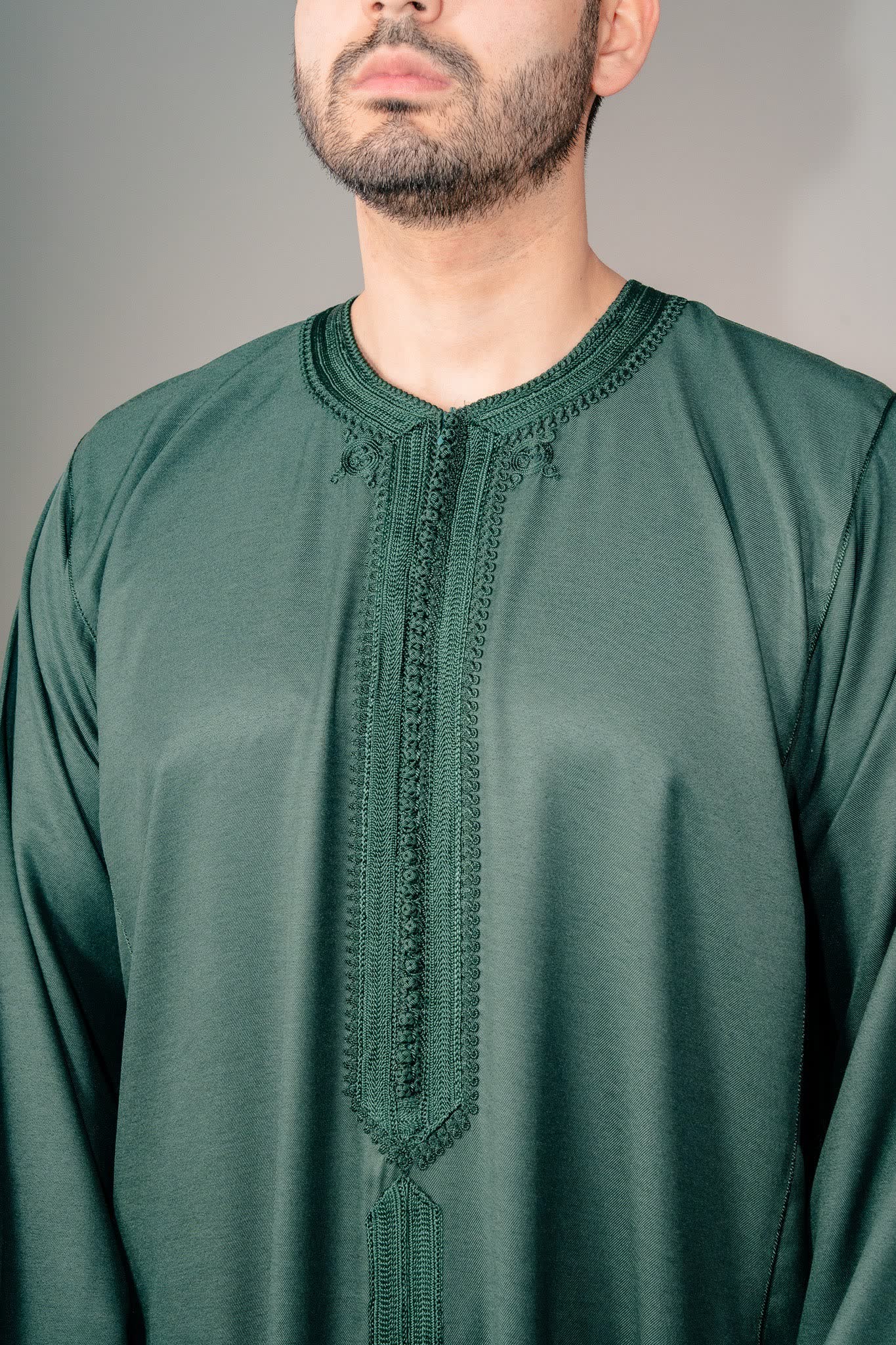 Embroidered placket and mandarin collar on a green Moroccan kaftan for men