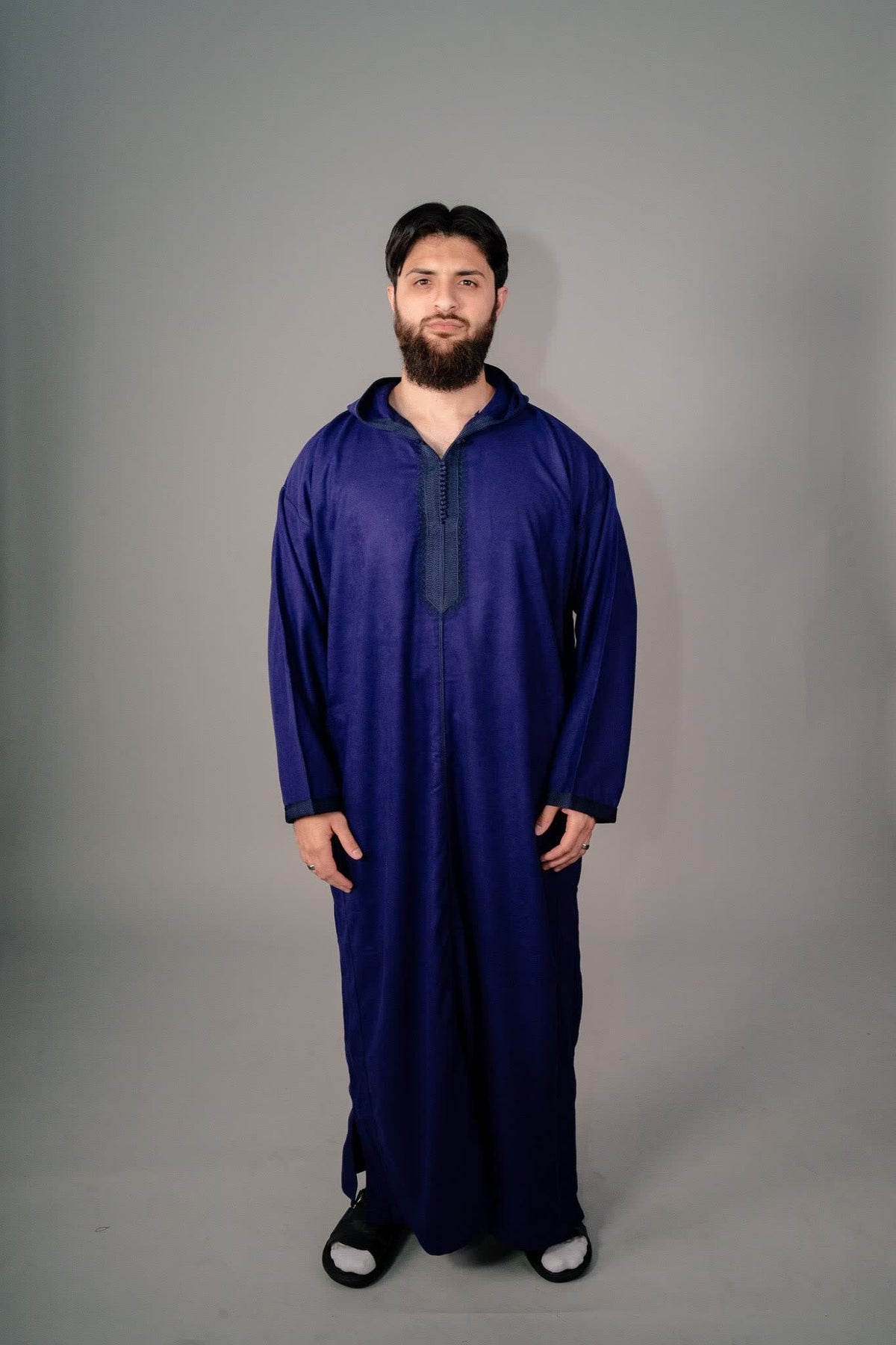 Side profile of an indigo purple Moroccan winter djellaba