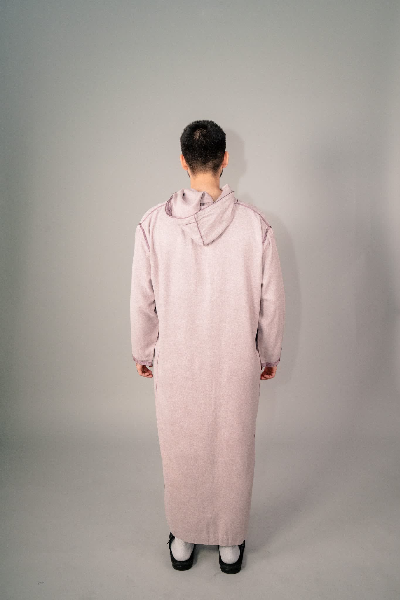 Back view of a lavender Moroccan djellaba with the hood down